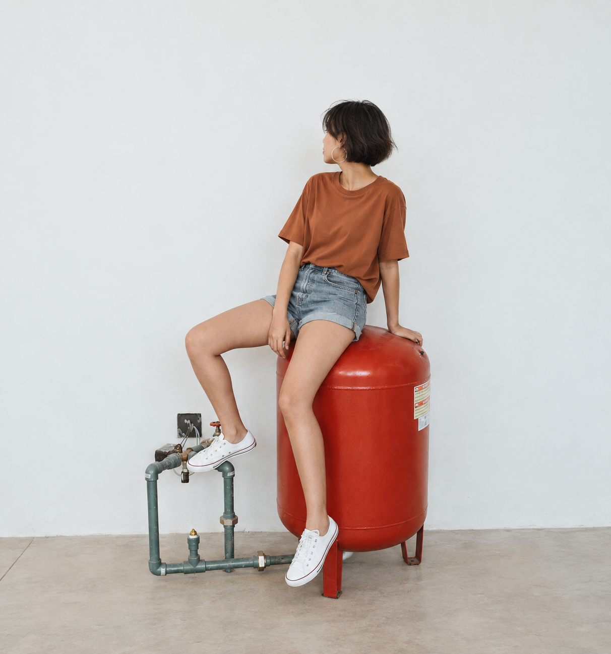 Bunrunners model seated on a red container